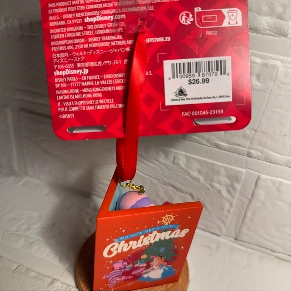 New Disney Cheshire Cat Christmas Ornament in Book Red and Purple